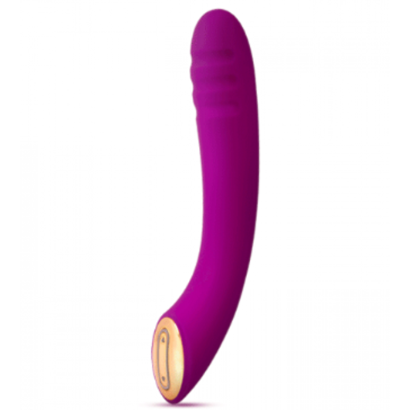 Overhead flat-lay photograph of a single curved purple personal massager with a textured tip and a soft gold-accented base resting on a clean white surface, soft natural lighting, calm retail mood in muted lavender and cream tones.